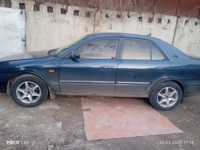 Синій Мазда 626, об'ємом двигуна 2 л та пробігом 495 тис. км за 1502 $, фото 1 на Automoto.ua