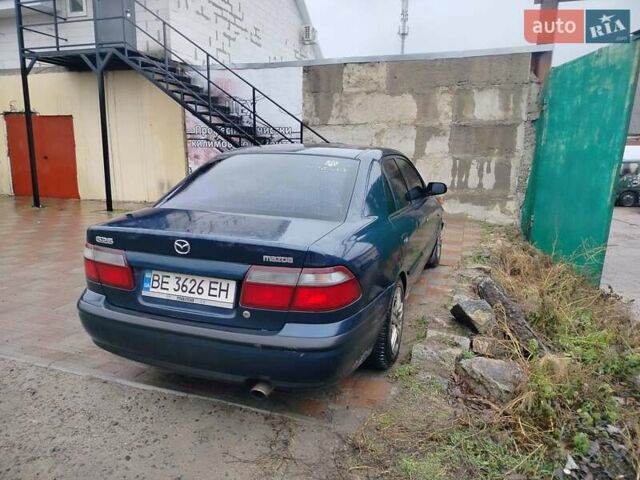 Синий Мазда 626, объемом двигателя 2 л и пробегом 320 тыс. км за 1500 $, фото 1 на Automoto.ua