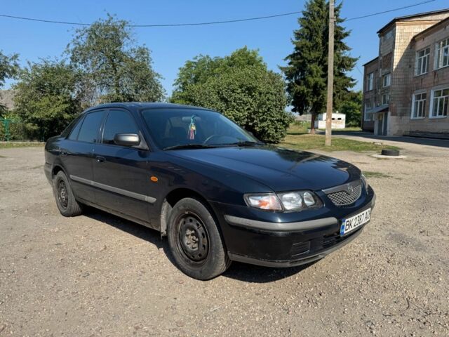 Синий Мазда 626, объемом двигателя 1.8 л и пробегом 200 тыс. км за 1556 $, фото 1 на Automoto.ua