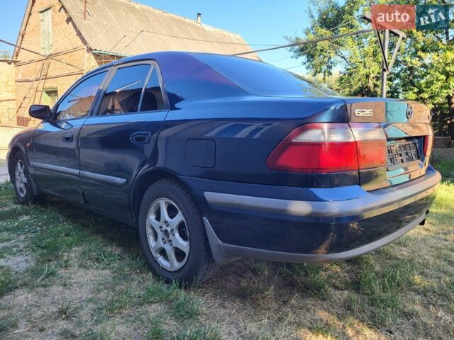 Синій Мазда 626, об'ємом двигуна 2 л та пробігом 475 тис. км за 2500 $, фото 1 на Automoto.ua