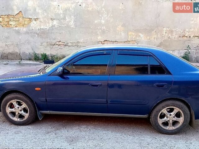 Синий Мазда 626, объемом двигателя 2 л и пробегом 500 тыс. км за 2600 $, фото 1 на Automoto.ua