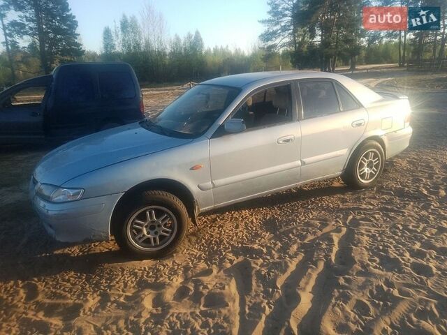 Синий Мазда 626, объемом двигателя 2 л и пробегом 300 тыс. км за 500 $, фото 1 на Automoto.ua