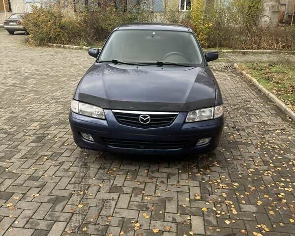 Синий Мазда 626, объемом двигателя 1.8 л и пробегом 395 тыс. км за 1500 $, фото 1 на Automoto.ua