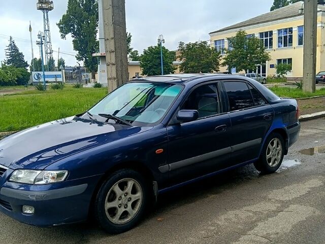 Синий Мазда 626, объемом двигателя 2 л и пробегом 248 тыс. км за 2100 $, фото 1 на Automoto.ua