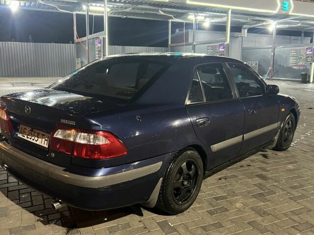 Синий Мазда 626, объемом двигателя 2 л и пробегом 315 тыс. км за 3300 $, фото 1 на Automoto.ua