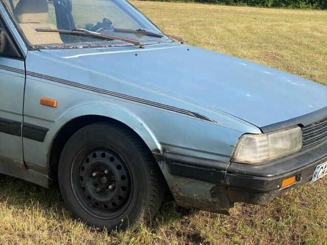 Синий Мазда 626, объемом двигателя 2 л и пробегом 512 тыс. км за 700 $, фото 1 на Automoto.ua