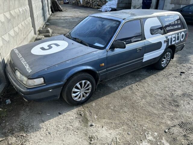 Синий Мазда 626, объемом двигателя 2 л и пробегом 250 тыс. км за 600 $, фото 1 на Automoto.ua