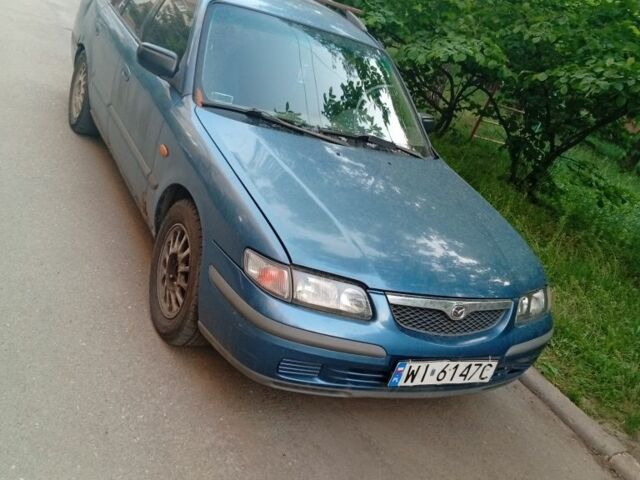 Синій Мазда 626, об'ємом двигуна 2 л та пробігом 108 тис. км за 603 $, фото 1 на Automoto.ua