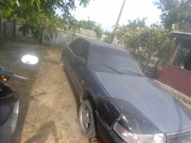 Синий Мазда 626, объемом двигателя 2 л и пробегом 300 тыс. км за 601 $, фото 1 на Automoto.ua