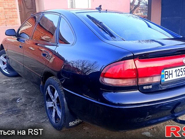 Синій Мазда 626, об'ємом двигуна 1.8 л та пробігом 200 тис. км за 1750 $, фото 1 на Automoto.ua