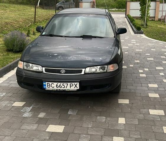 Синий Мазда 626, объемом двигателя 1.8 л и пробегом 350 тыс. км за 1750 $, фото 1 на Automoto.ua