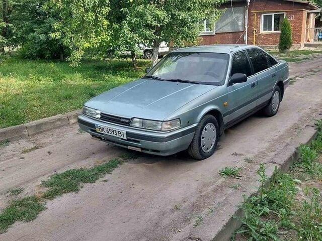Зеленый Мазда 626, объемом двигателя 2 л и пробегом 300 тыс. км за 750 $, фото 1 на Automoto.ua