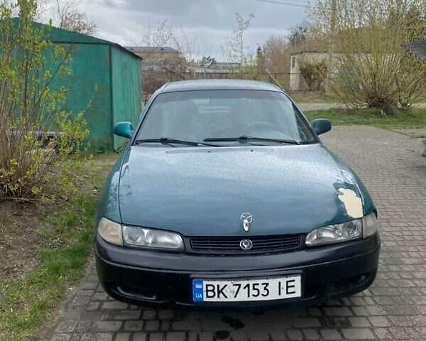 Зеленый Мазда 626, объемом двигателя 2 л и пробегом 350 тыс. км за 800 $, фото 1 на Automoto.ua