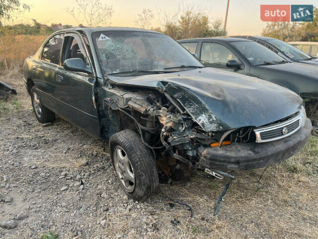 Зеленый Мазда 626, объемом двигателя 2 л и пробегом 256 тыс. км за 500 $, фото 1 на Automoto.ua