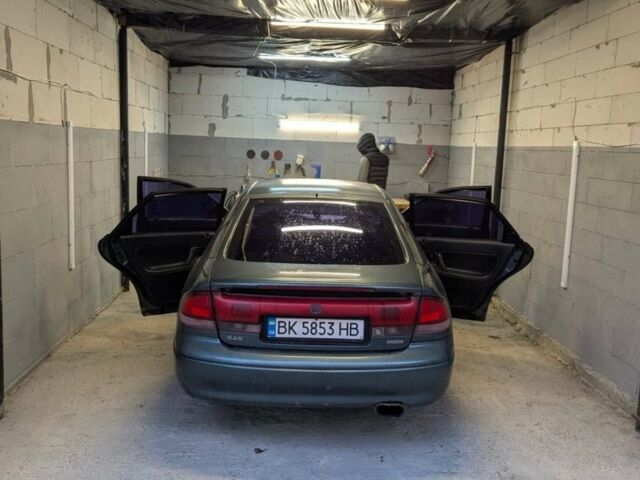 Зеленый Мазда 626, объемом двигателя 1.8 л и пробегом 470 тыс. км за 2100 $, фото 1 на Automoto.ua