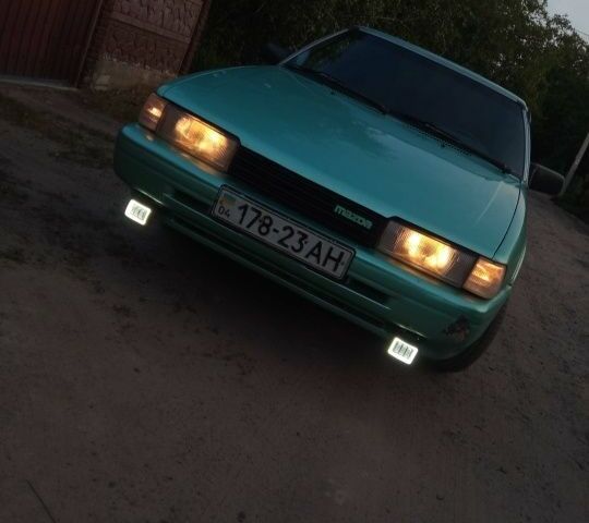 Зеленый Мазда 626, объемом двигателя 2 л и пробегом 175 тыс. км за 1000 $, фото 1 на Automoto.ua