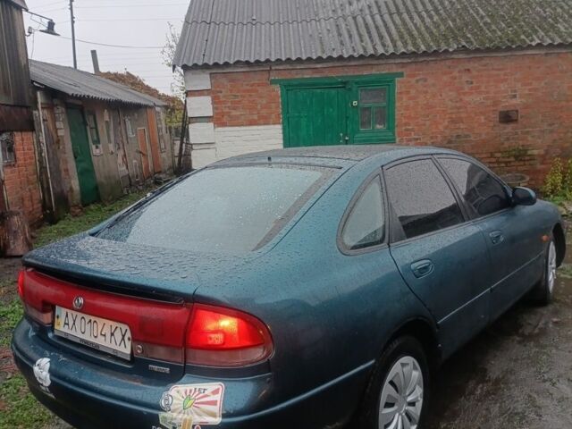 Зеленый Мазда 626, объемом двигателя 2 л и пробегом 350 тыс. км за 1200 $, фото 1 на Automoto.ua