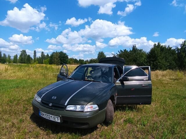 Зеленый Мазда 626, объемом двигателя 2 л и пробегом 365 тыс. км за 500 $, фото 1 на Automoto.ua