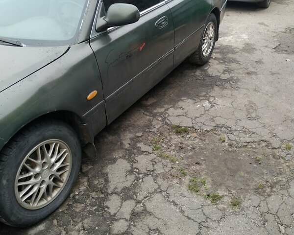 Зеленый Мазда 626, объемом двигателя 2 л и пробегом 345 тыс. км за 800 $, фото 1 на Automoto.ua