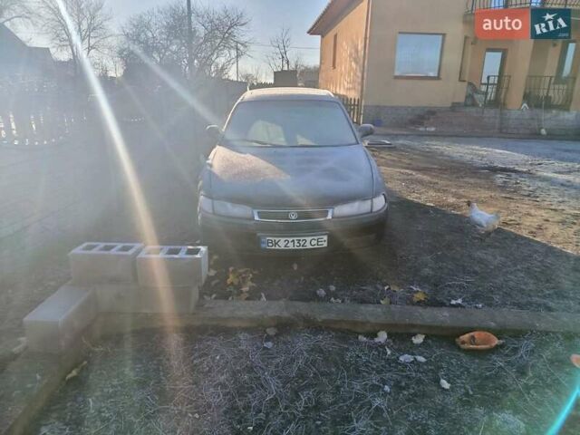 Зеленый Мазда 626, объемом двигателя 2 л и пробегом 211 тыс. км за 1450 $, фото 1 на Automoto.ua