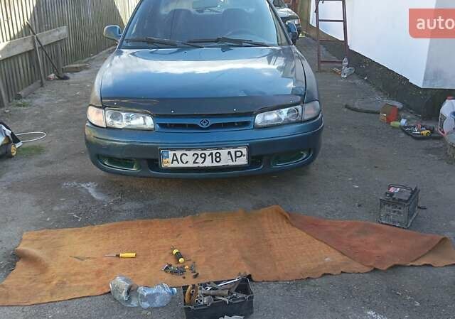 Зеленый Мазда 626, объемом двигателя 2 л и пробегом 200 тыс. км за 1500 $, фото 1 на Automoto.ua