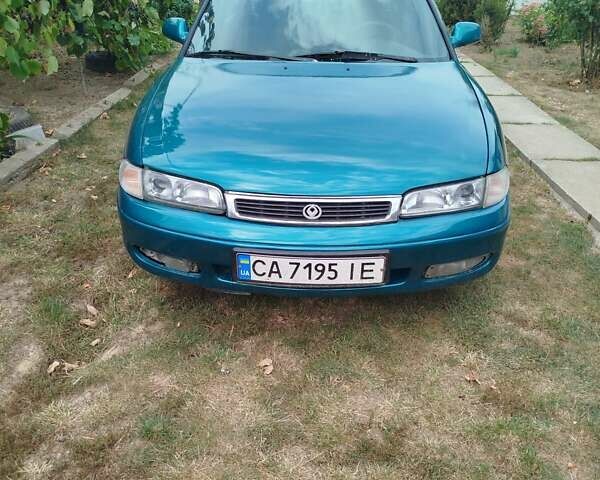 Зеленый Мазда 626, объемом двигателя 2 л и пробегом 360 тыс. км за 2100 $, фото 1 на Automoto.ua