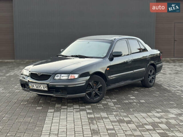 Зеленый Мазда 626, объемом двигателя 2 л и пробегом 309 тыс. км за 2100 $, фото 1 на Automoto.ua