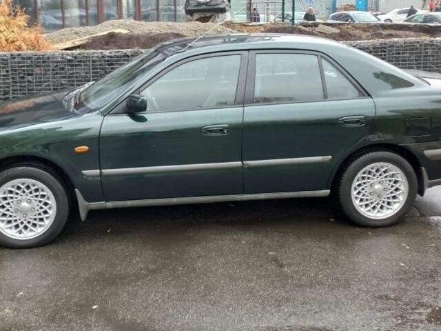 Зеленый Мазда 626, объемом двигателя 2 л и пробегом 250 тыс. км за 3600 $, фото 1 на Automoto.ua