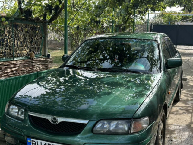 Зеленый Мазда 626, объемом двигателя 2 л и пробегом 314 тыс. км за 1800 $, фото 1 на Automoto.ua