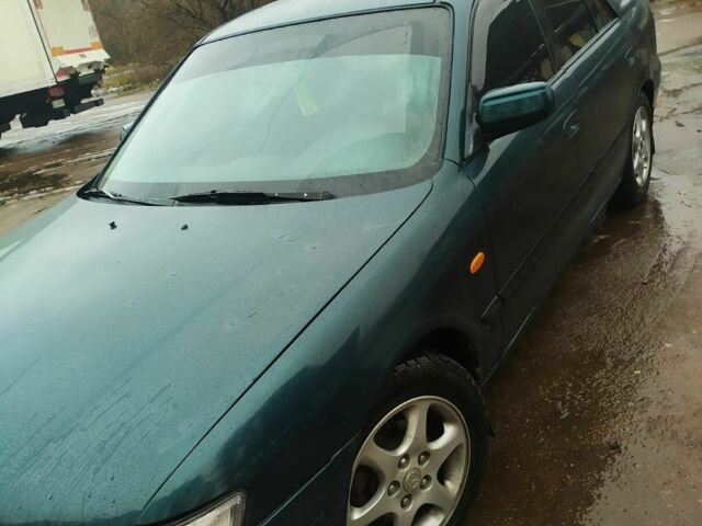 Зеленый Мазда 626, объемом двигателя 2 л и пробегом 5 тыс. км за 1800 $, фото 1 на Automoto.ua