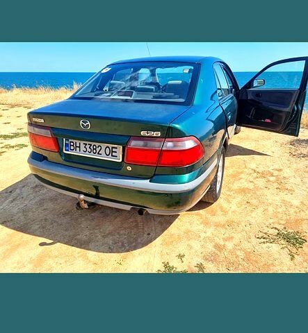 Зеленый Мазда 626, объемом двигателя 2 л и пробегом 230 тыс. км за 2200 $, фото 1 на Automoto.ua
