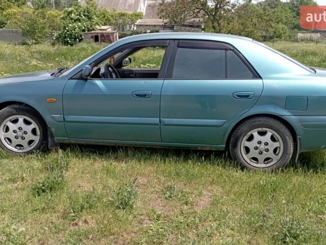 Зеленый Мазда 626, объемом двигателя 1.8 л и пробегом 230 тыс. км за 2999 $, фото 1 на Automoto.ua