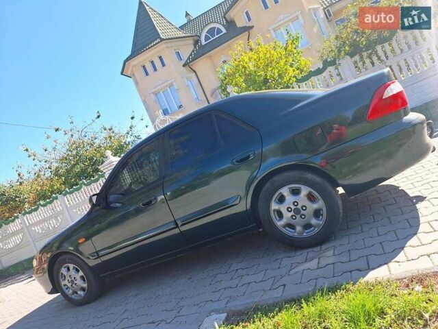 Зеленый Мазда 626, объемом двигателя 2 л и пробегом 285 тыс. км за 2400 $, фото 1 на Automoto.ua