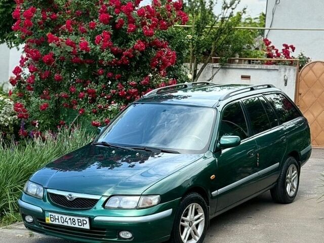 Зеленый Мазда 626, объемом двигателя 2 л и пробегом 200 тыс. км за 3699 $, фото 1 на Automoto.ua