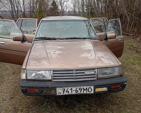 Коричневый Мазда 929, объемом двигателя 2 л и пробегом 290 тыс. км за 1300 $, фото 1 на Automoto.ua