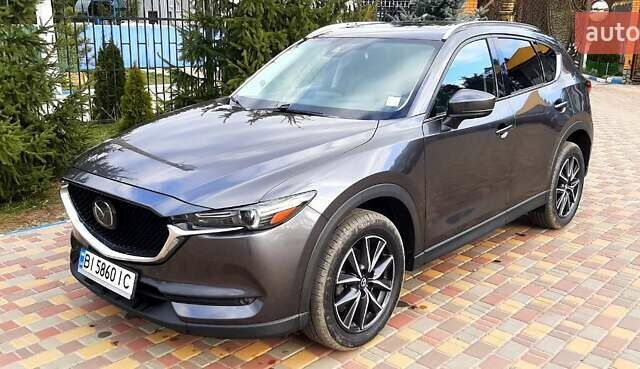 Серый Мазда СХ-5, объемом двигателя 2.49 л и пробегом 120 тыс. км за 15000 $, фото 1 на Automoto.ua