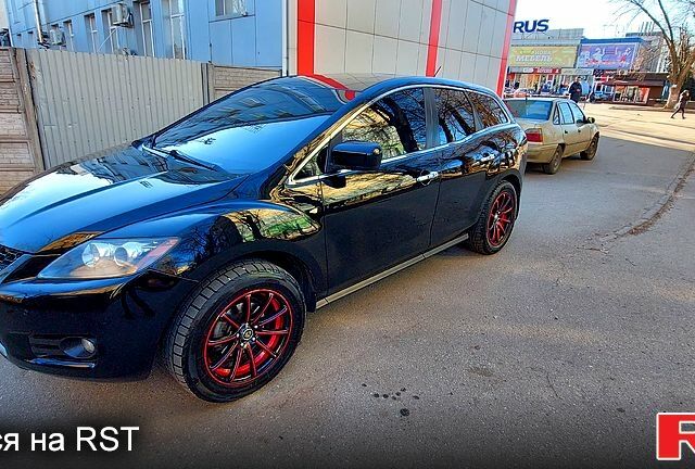 Черный Мазда СХ-7, объемом двигателя 2.3 л и пробегом 300 тыс. км за 6500 $, фото 1 на Automoto.ua