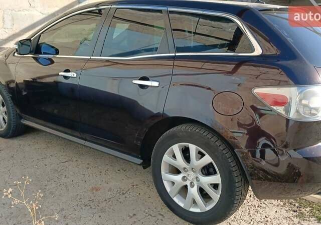 Черный Мазда СХ-7, объемом двигателя 2.3 л и пробегом 180 тыс. км за 7200 $, фото 1 на Automoto.ua