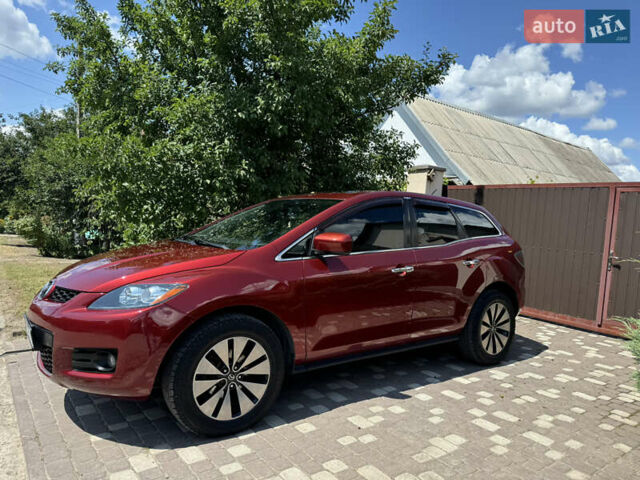 Красный Мазда СХ-7, объемом двигателя 2.3 л и пробегом 124 тыс. км за 6400 $, фото 1 на Automoto.ua