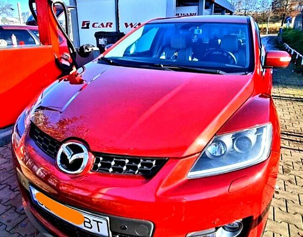 Красный Мазда СХ-7, объемом двигателя 2.3 л и пробегом 240 тыс. км за 7500 $, фото 1 на Automoto.ua