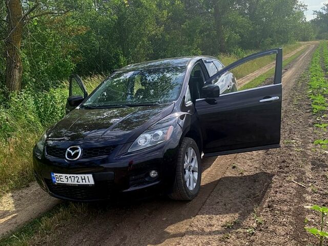 Красный Мазда СХ-7, объемом двигателя 2.3 л и пробегом 189 тыс. км за 7750 $, фото 1 на Automoto.ua