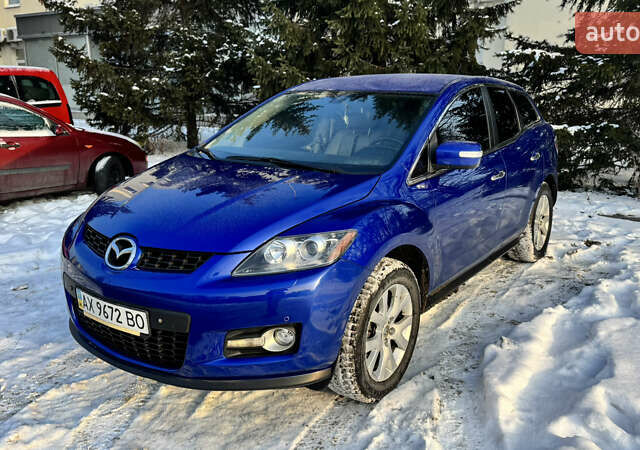 Синий Мазда СХ-7, объемом двигателя 2.3 л и пробегом 117 тыс. км за 6650 $, фото 1 на Automoto.ua
