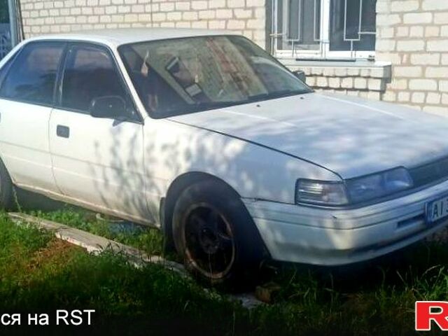 Белый Мазда Капелла, объемом двигателя 1.8 л и пробегом 520 тыс. км за 700 $, фото 1 на Automoto.ua