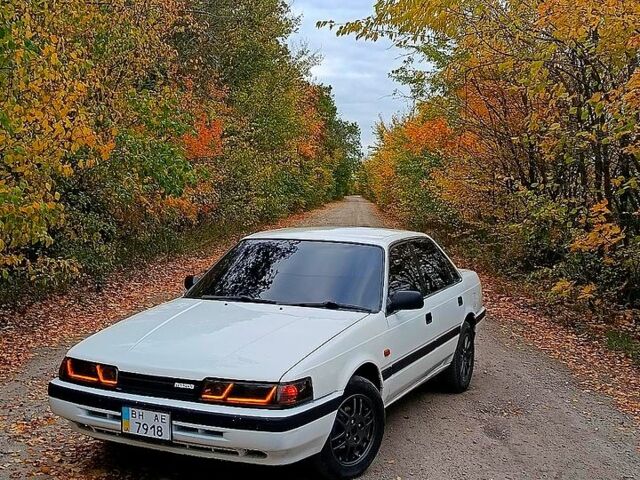 Белый Мазда Капелла, объемом двигателя 2 л и пробегом 150 тыс. км за 1500 $, фото 1 на Automoto.ua