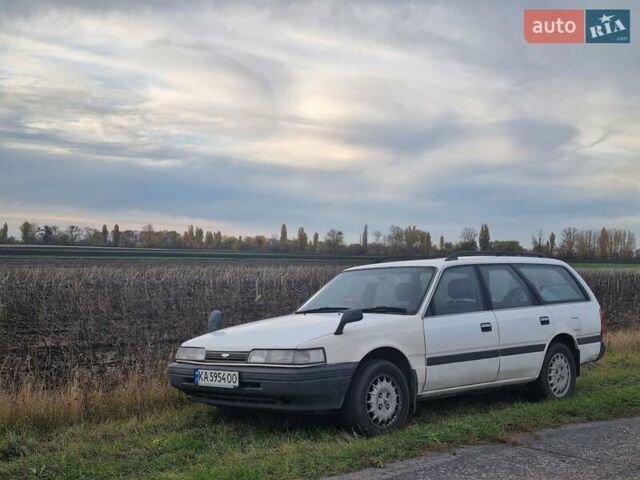 Белый Мазда Капелла, объемом двигателя 1.6 л и пробегом 154 тыс. км за 3000 $, фото 1 на Automoto.ua