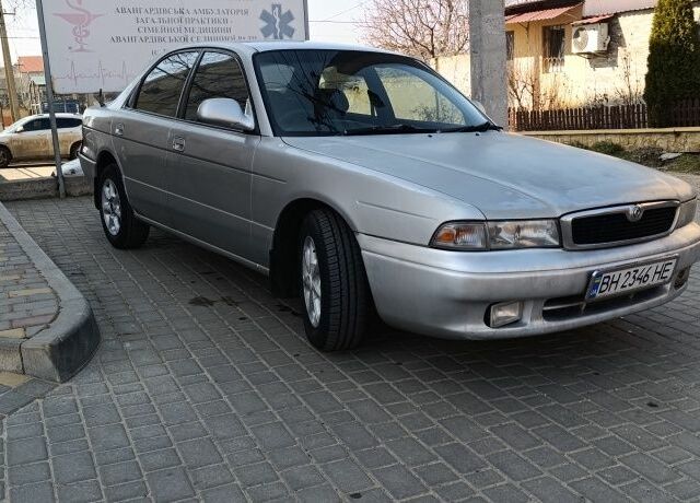 Серый Мазда Капелла, объемом двигателя 1.8 л и пробегом 370 тыс. км за 1650 $, фото 1 на Automoto.ua