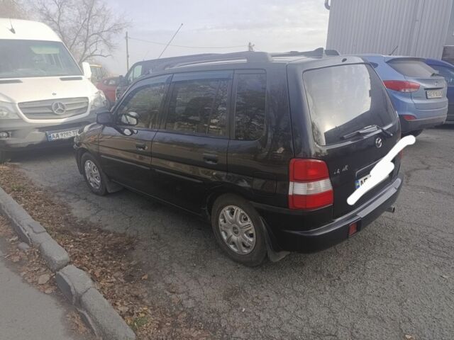 Чорний Мазда Деміо, об'ємом двигуна 1 л та пробігом 1 тис. км за 2600 $, фото 1 на Automoto.ua