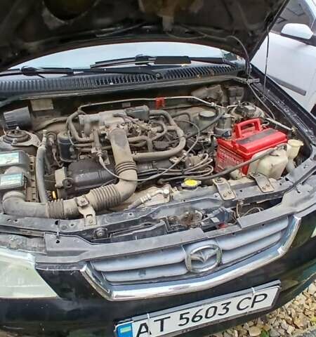 Черный Мазда Демио, объемом двигателя 1.5 л и пробегом 280 тыс. км за 2500 $, фото 1 на Automoto.ua