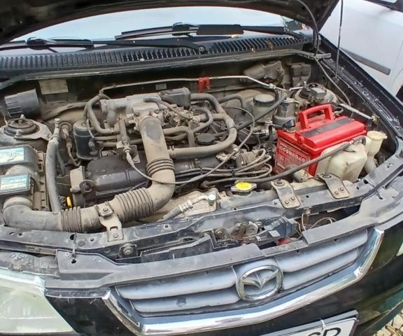 Черный Мазда Демио, объемом двигателя 1.5 л и пробегом 280 тыс. км за 2500 $, фото 1 на Automoto.ua