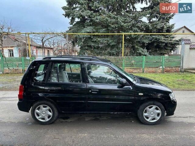 Чорний Мазда Деміо, об'ємом двигуна 1.5 л та пробігом 335 тис. км за 1950 $, фото 1 на Automoto.ua